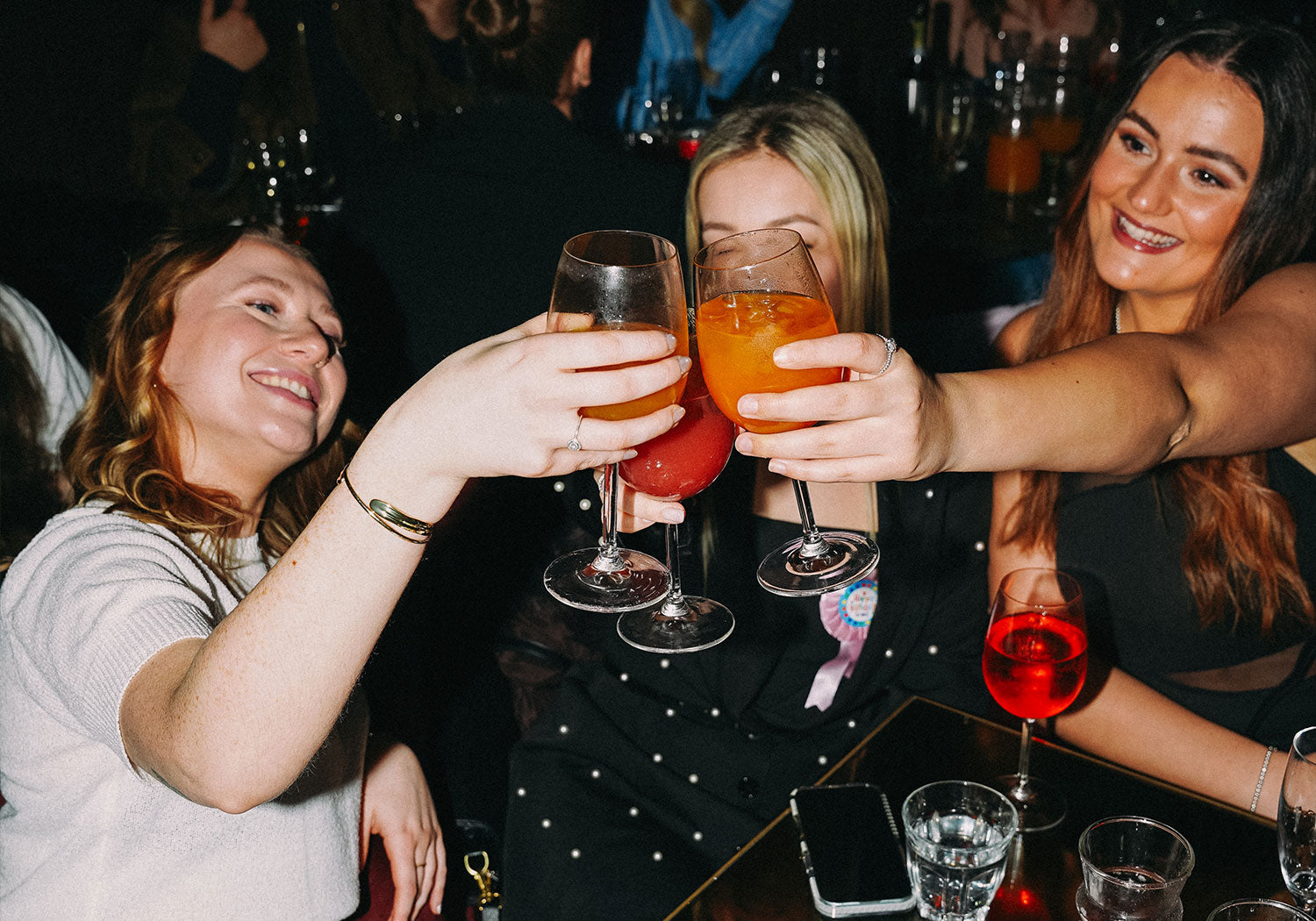 Brunch girls at PizzaExpress enjoying bottomless Aeprol spirtz and cocktails close up